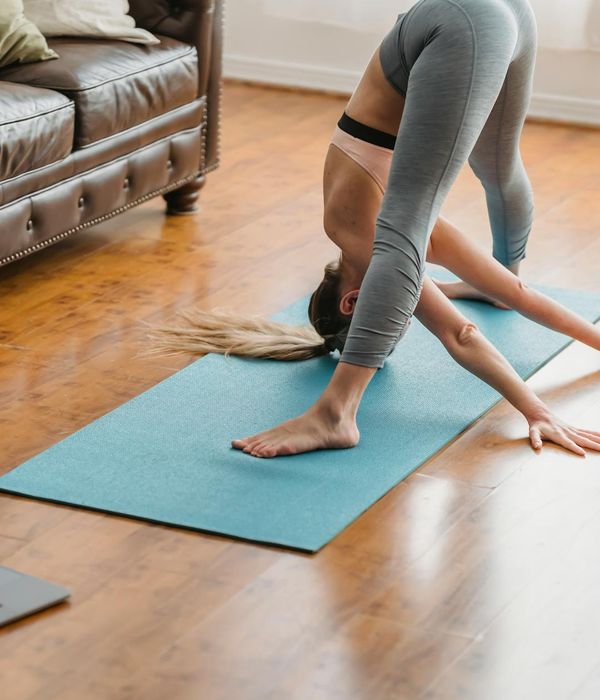 Woman feeling energized and flexible during a home workout session.